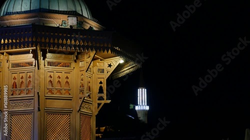 Sarajevo, Bosnia and Herzegovina, June, 2017 - Old town at night, the landmark Sebilj and the central Beys mosque nearby, the shot is moving from the top to the bottom... photo