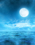Romantic night sky with full moon above the sea.