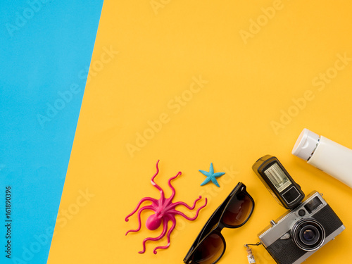 Summer Flat Lay Photo with blue and yellow background.