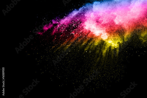 abstract color powder splatted on black background,Freeze motion of color powder exploding. © Pattadis