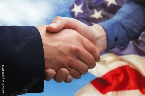 Composite image of corporate people shaking hands