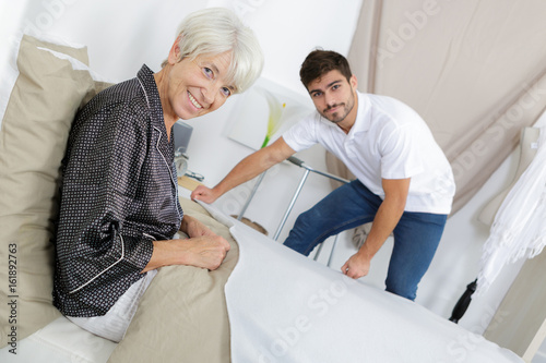 Photos bedridden employer posing and smiling