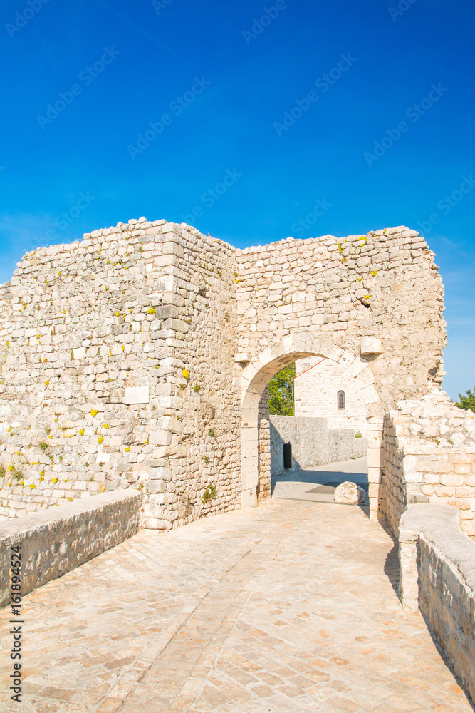     Old stone upper town gate in medieval historic town of Nin, Dalmatia, Croatia 