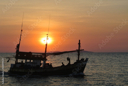 Fishing boat in sun photo