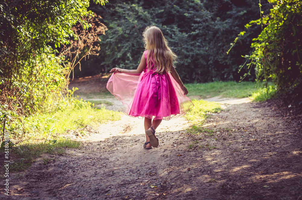 little child walking in the nature