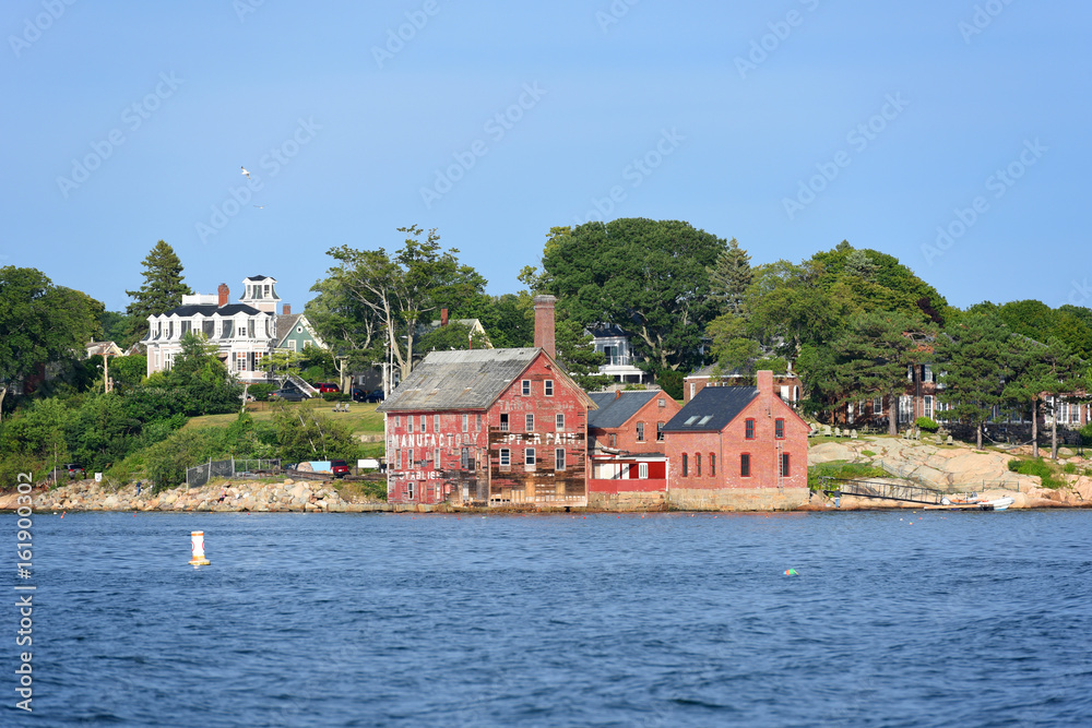 Obraz premium Tarr and Wonson Paint Manufactory is one of the most famous landmarks on the North Shore Massachusetts in Gloucester Harbor, Massachusetts, USA.