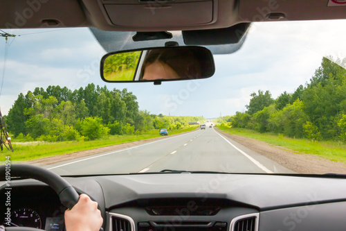 View of the road through the windshield of the car