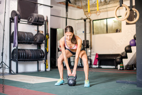 Girl working out with kettlebell