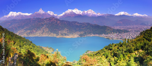 Himalayas. Horizontal panoramic view to Pokhara valley,  Phewa lake and the magnificent Annapurna mountain range from hillside.