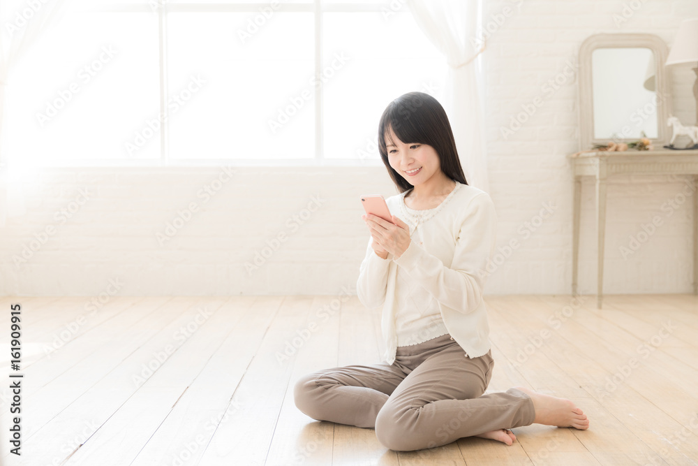 attractive asian woman using smart phone