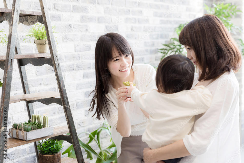 young asian family relaxing in living room young asian family relaxing in living room