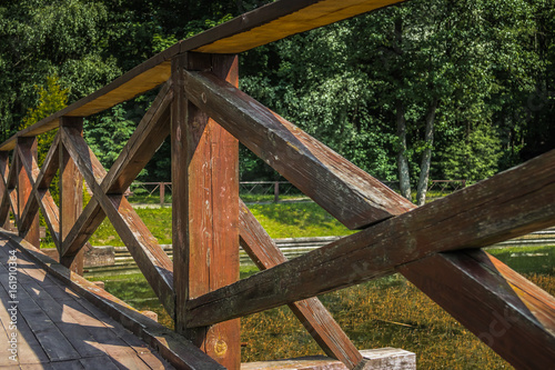 Fence along the bridge over the river, lake, water.
