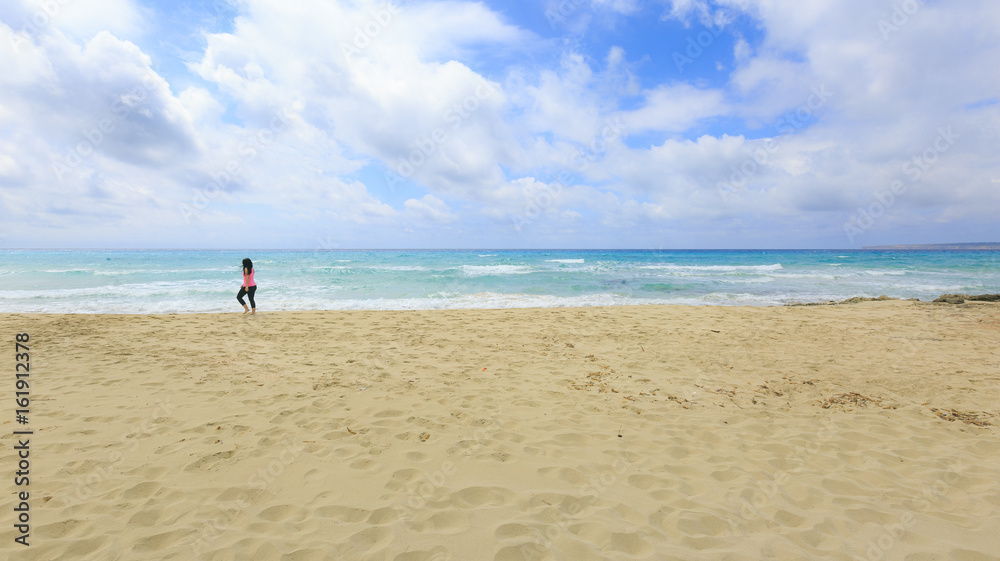 Girl walking on the beach