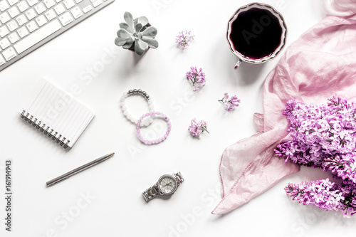 Woman office desk with keyboard, coffee and lilac blossom design white background top view mockup