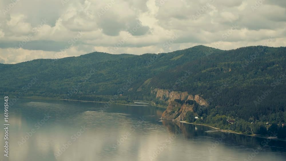 The Great Russian River Yenisei. Beautiful rocks overgrown with taiga forest The Great Russian River Yenisei. Beautiful rocks overgrown with taiga forest