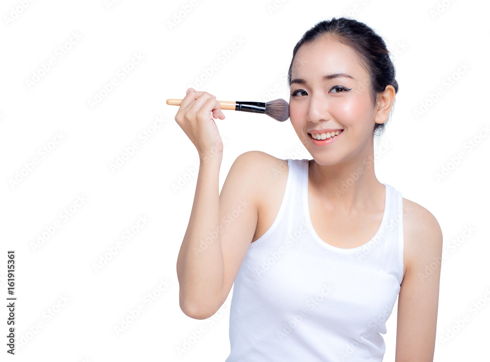 Portrait of the beautiful woman with makeup brushes near face Portrait of the beautiful woman with makeup brushes near face