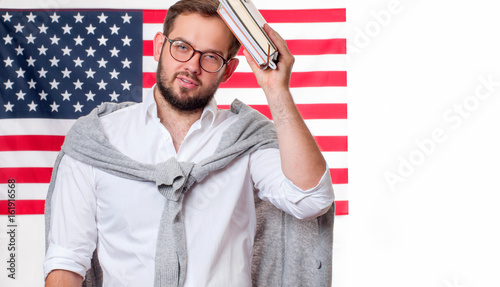 Smiling young man on United States flag background. photo