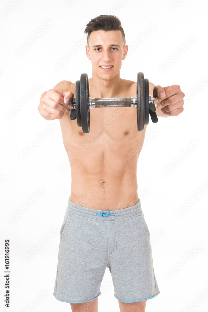Muscular young sportsman exercising on white background