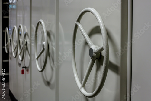 Large office filling cabinet with steering wheel photo