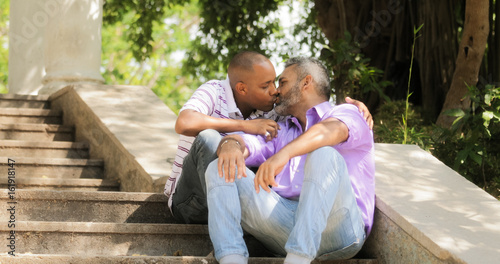 Gay People Two Men Kissing On Stairs In Park
