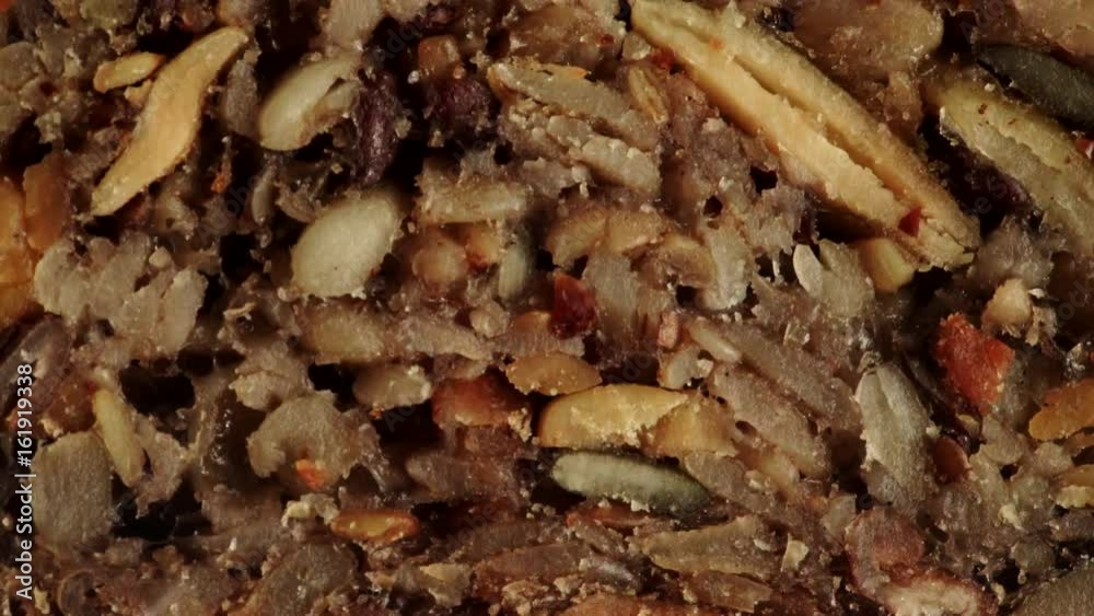 Nobody. Close up of homemade gluten free bread with seeds and nuts. Dolly slider shot 4K ProRes HQ codec