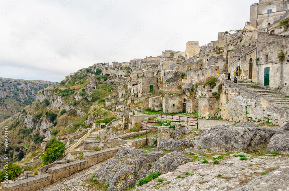 The cave-town Sasso Caveoso at the edge of La Gravina - Matera, Basilicata, Italy