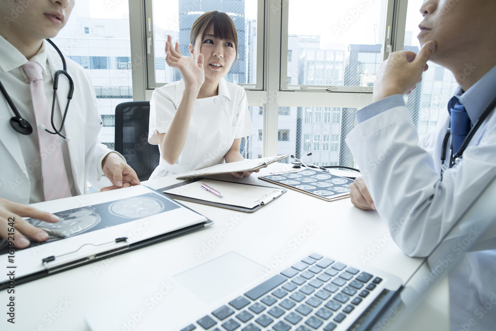 Fototapeta premium Doctors and nurses are talking about patients