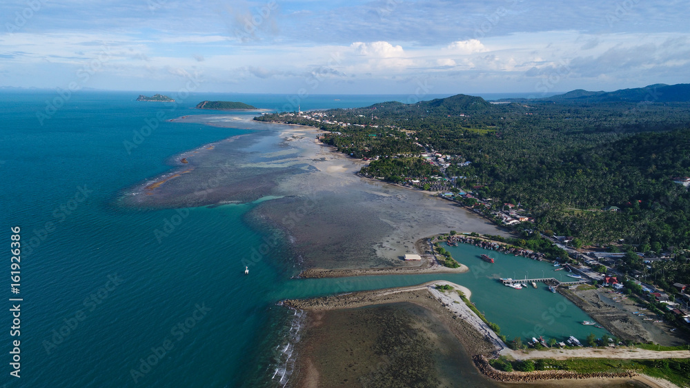 Aerial view of fisherman village marina on the tropical island 