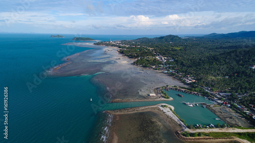 Aerial view of fisherman village marina on the tropical island 