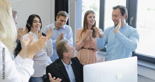 Happy Business People Group Clapping Hands Congradulating Boss With Success, Cheerful Successful Team In Modern Office Slow Motion 60 photo