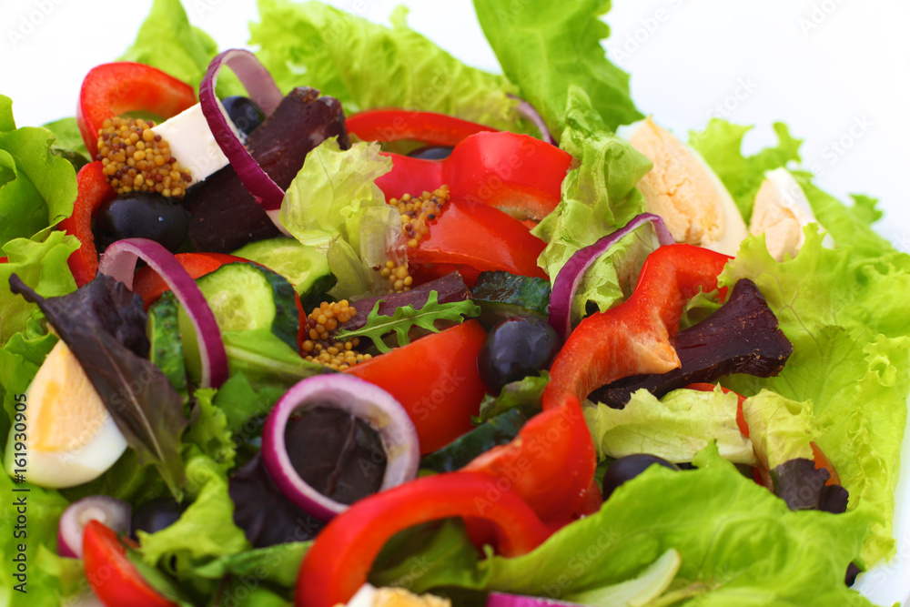 salad from fresh vegetables in a plate on a table, selective focus salad from fresh vegetables in a plate on a table, selective focus