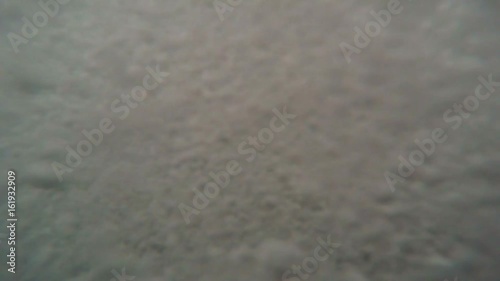 Waves With Foam Covers Camera a Lot of Bubbles Among Stones With Seaweeds Mediterranean Sea photo
