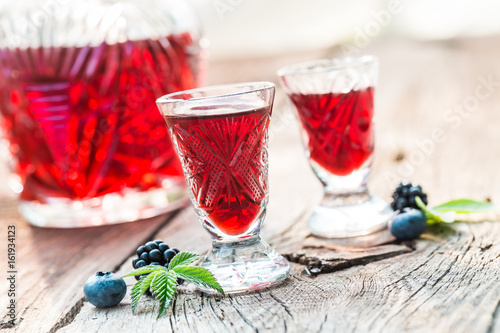 Fresh liquor with berry fruits and alcohol in summer