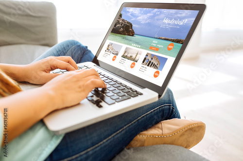 woman looking for a vacation on a laptop