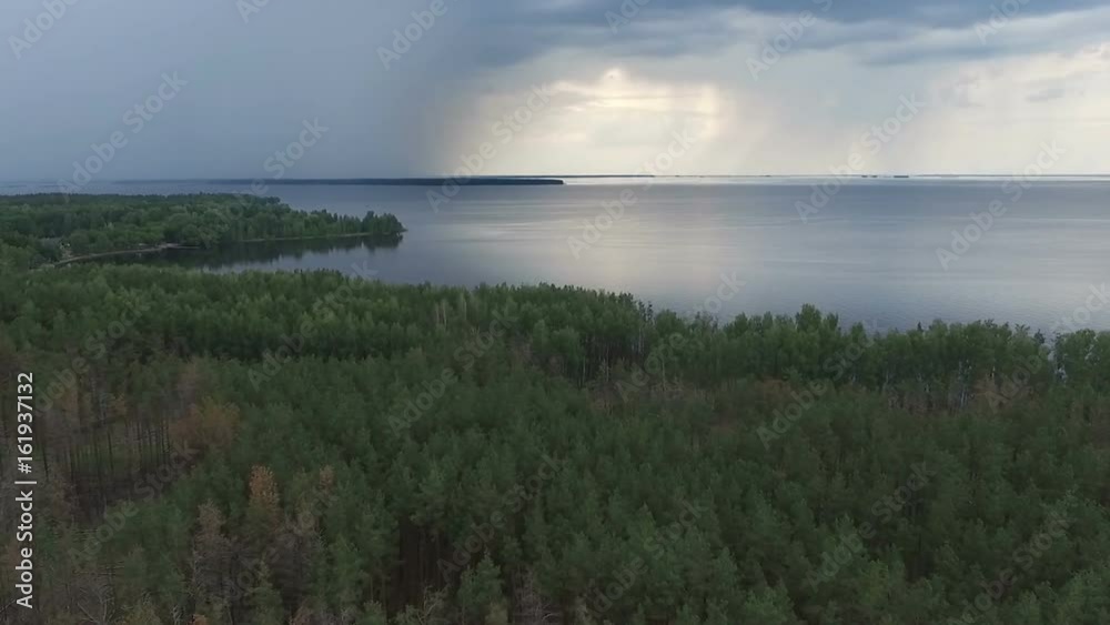Fly over the coastline and green forest. Aerial view footage. Fly over the coastline and green forest. Aerial view footage.