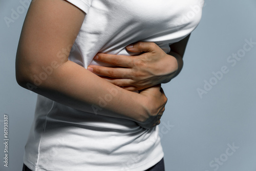 young woman having a stomachache. photo