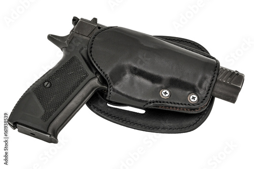 Molded leather holster with handgun. Isolated