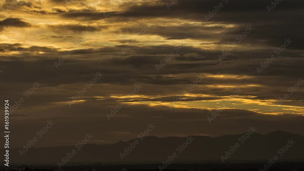 Time Lapse of Colorful dramatic sky with cloud at sunset.Sky with sun background Time Lapse of Colorful dramatic sky with cloud at sunset.Sky with sun background