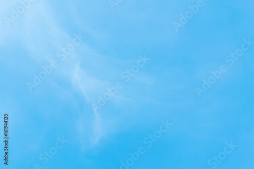 clear blue sky with plain white cloud with space for text