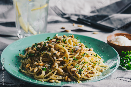 Spaghetti with pine nuts, butter and parsley. photo