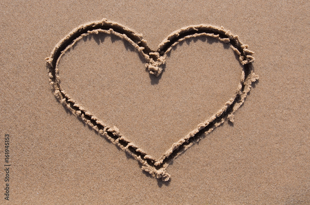 Heart drawn in the sand. Beach background. Heart drawn in the sand. Beach background.
