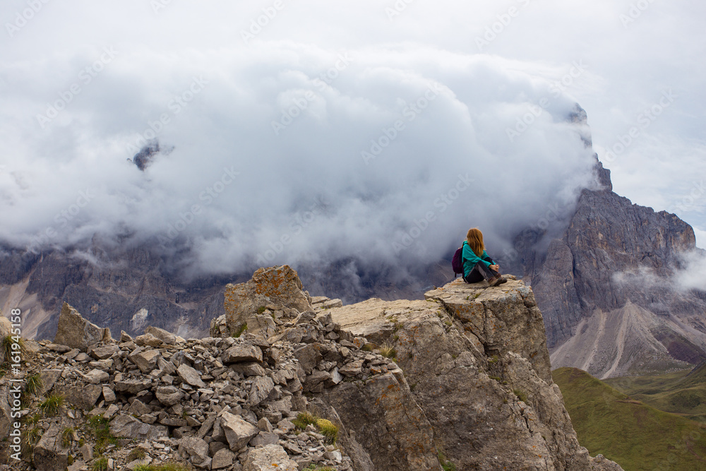 girl hiker on a cliff