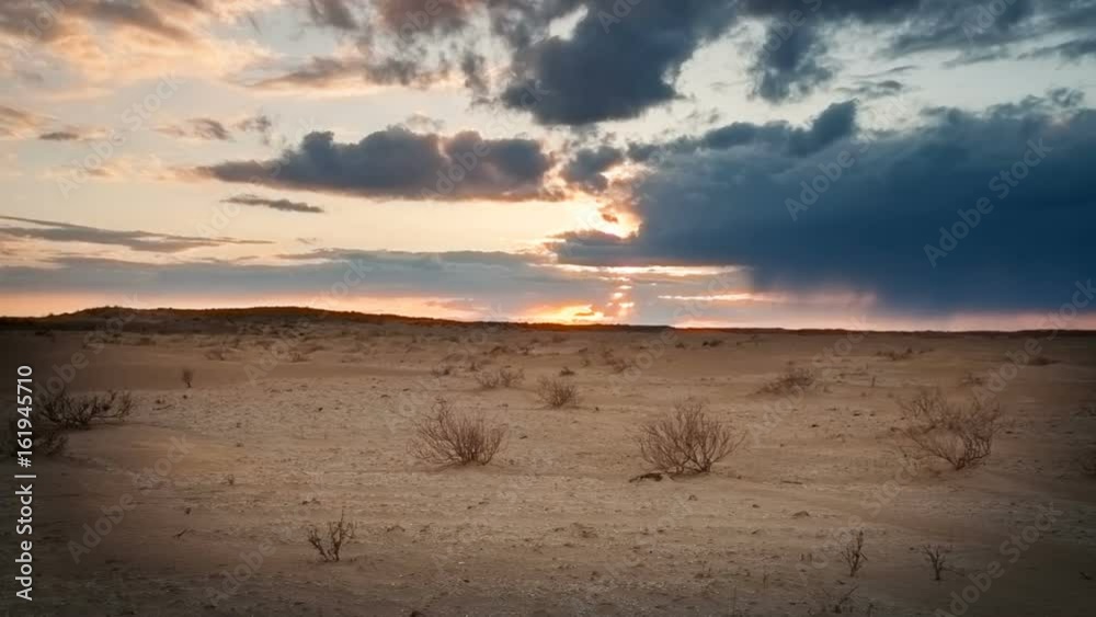 Clouds float over the desert at sunset. Timelapse Clouds float over the desert at sunset. Timelapse