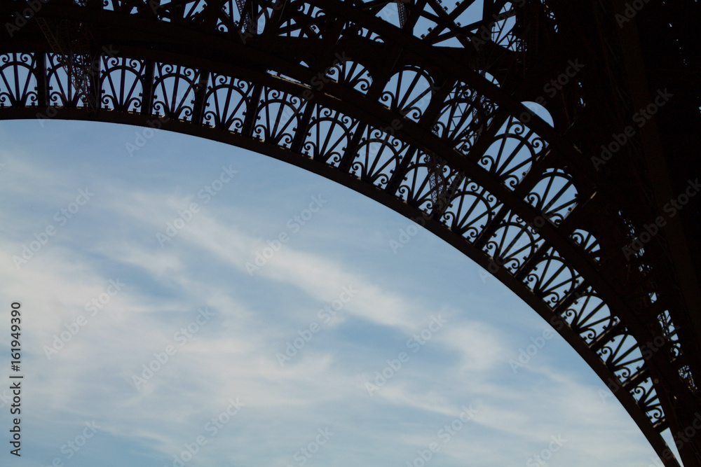 detail of Eiffel tower silhouette on sky background