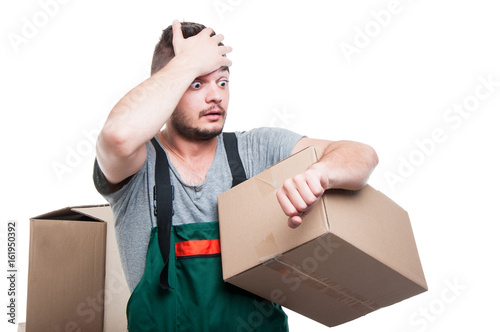 Mover guy holding cardboard gesturing being late photo