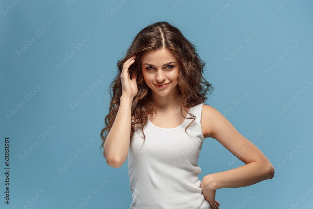 The young woman's portrait with happy emotions The young woman's portrait with happy emotions