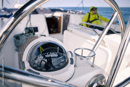 Close up of nautical compass on yacht