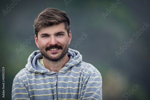 Portrait of a smiling,handsome attractive man with beard and mustache