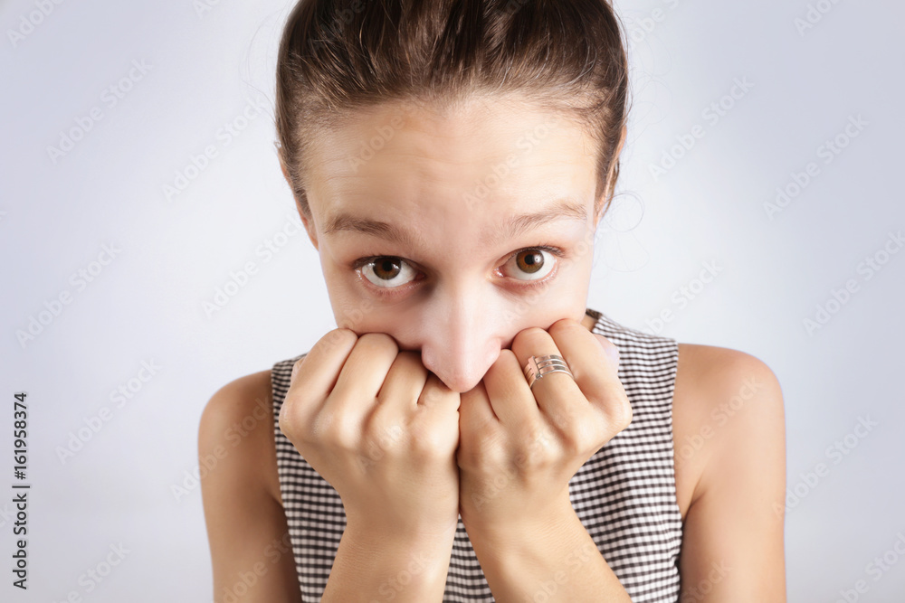 Funny portrait of woman hiding face and looking at camera Funny portrait of woman hiding face and looking at camera