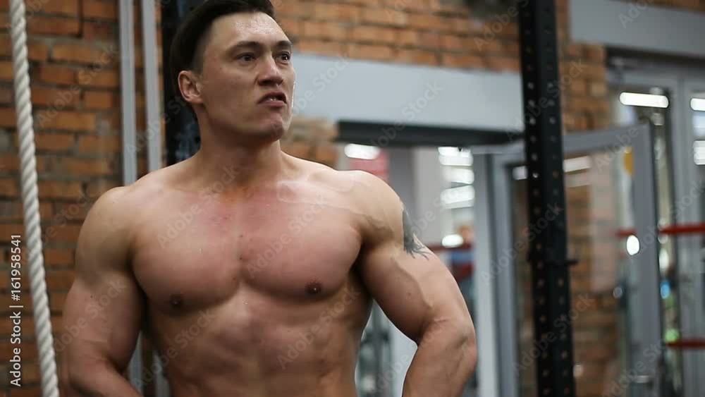 Posing muscular bodybuilder Posing muscular bodybuilder